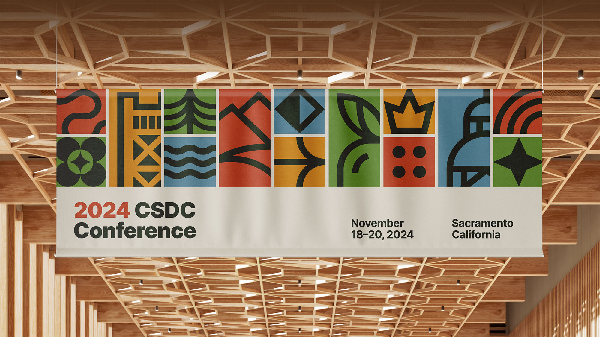 The CSDC 2024 Conference banner displayed hanging from a wooden beam ceiling